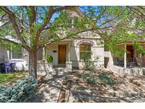 Charming home featuring a manicured front yard and a welcoming entryway at 1529 E 22Nd Ave, Denver, CO 80205