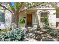 Close-up of a front exterior showcasing a well-kept yard and inviting entrance at 1529 E 22Nd Ave, Denver, CO 80205