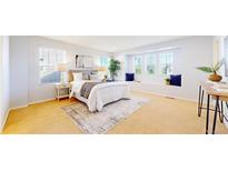Bright main bedroom with a large window seat and neutral tones at 7932 E 49Th Pl, Denver, CO 80238