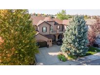 Nice two-story house with a landscaped yard and a two-car garage at 2675 Timberchase Trl, Highlands Ranch, CO 80126