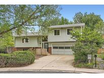 Charming two-story home with a well-maintained lawn and an attached garage at 1800 Centaur Village Dr, Lafayette, CO 80026