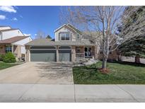 Charming two-story home featuring a large two car garage and well-maintained landscaping at 15432 Greenstone Cir, Parker, CO 80134