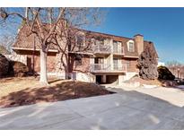 Brick building exterior with balconies and parking at 1370 S Idalia St # C, Aurora, CO 80017