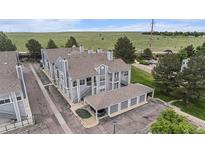 Inviting townhome complex boasts well-maintained landscaping and convenient covered parking at 7453 Singing Hills Dr, Boulder, CO 80301