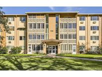 Apartment building exterior featuring well-maintained landscaping and architectural details at 750 S Clinton St # 2C, Denver, CO 80247