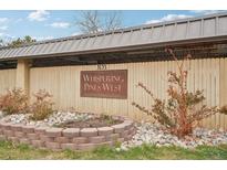 Whispering Pines West features well-maintained landscaping and is a covenant-controlled community at 7395 E Quincy Ave # 207, Denver, CO 80237
