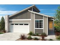 Charming single-Gathering home featuring a stone-accented garage and a well-manicured front yard at 9332 Bahama Ct, Commerce City, CO 80022