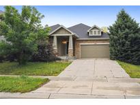 Charming single-Gathering home with a well-maintained lawn and a two-car garage at 179 N Prairie Falcon Pkwy, Brighton, CO 80601