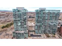 Stunning aerial view of modern high-rise apartments featuring a central outdoor space with a pool and city views at 1700 Bassett St # 820, Denver, CO 80202