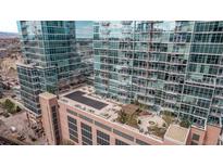 Stunning aerial view of modern high-rise buildings with reflective glass and rooftop lounge at 1700 Bassett St # 820, Denver, CO 80202