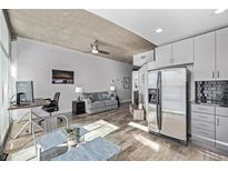 Stylish condo with exposed concrete ceilings, hardwood floors and modern furnishings at 1700 Bassett St # 820, Denver, CO 80202