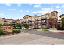 Beautiful exterior of the Lincoln Square Lofts featuring manicured landscaping and visible parking at 10184 Park Meadows Dr # 1317, Lone Tree, CO 80124