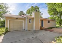 Charming single-story home with an attached garage and cozy curb appeal at 6396 Twin Lakes Rd, Boulder, CO 80301