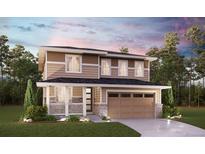 This stunning two-story home features a modern design, attached two-car garage and welcoming front porch at 24790 E 39Th Ave, Aurora, CO 80019