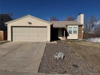 Charming single-Gathering home featuring a well-manicured lawn and a two-car garage at 2735 S Uravan St, Aurora, CO 80013