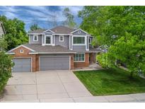 Charming two-story home featuring a well-manicured front yard and attached two-car garage at 2204 Lasalle St, Superior, CO 80027