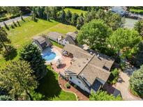 Expansive estate with private pool, outdoor patio, and lush landscaping on a sprawling lot at 3500 S Franklin St, Englewood, CO 80113