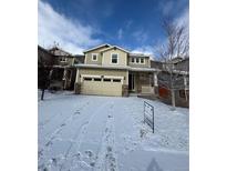 Charming two-story home with a two-car garage and inviting front porch, perfect for families at 10611 Casper St, Parker, CO 80134