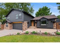Charming two-story home with a stylish gray exterior, stone accents, and a well-manicured front yard at 4269 Carter Trl, Boulder, CO 80301