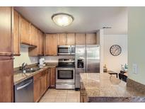Well-lit kitchen featuring stainless steel appliances and granite countertops, perfect for culinary enthusiasts at 4500 Baseline Rd # 3101, Boulder, CO 80303
