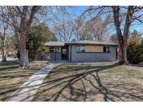 Charming single-story home with a well-maintained front yard and inviting walkway at 2202 S Grape St, Denver, CO 80222