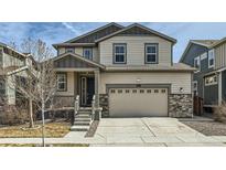 Charming two-story home with a two car garage, and neutral color palette at 9544 Pitkin St, Commerce City, CO 80022