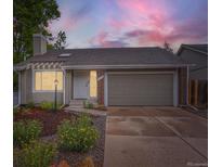 Charming home featuring a well-maintained yard and attached two-car garage at 6378 S Emporia Cir, Englewood, CO 80111
