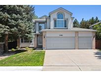 Charming two-story home boasts a three-car garage and well-maintained front yard at 13362 Marion St, Thornton, CO 80241