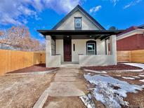 Charming single-Gathering home featuring a covered porch and a freshly landscaped front yard at 3120 N Race St, Denver, CO 80205