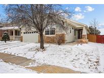 Charming single-Gathering home with a well-maintained front yard and an attached two-car garage at 16278 E 105Th Way, Commerce City, CO 80022