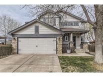 Charming two-story home featuring a two-car garage and stone accents at 10767 Appaloosa Ct, Parker, CO 80134