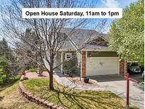 Charming home with a two-car garage and a well-maintained lawn, announcing open house Saturday at 6701 W Yale Ave, Lakewood, CO 80227