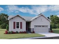 Charming one-story home showcasing light siding, red window shutters, and a two-car garage at 1306 Sienna Peak Cir, Erie, CO 80516