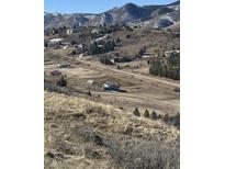 Charming single-story home nestled in a mountain community, offering a serene and picturesque setting at 5826 High Toll Trl, Morrison, CO 80465
