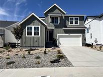 Charming two-story home featuring a two-car garage, modern windows, and low-maintenance landscaping at 4225 Ridgewalk Pt, Castle Rock, CO 80108