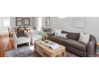 Cozy living room with stylish furniture and hardwood floors for a comfortable and inviting space at 1025 E Iowa Ave, Denver, CO 80210