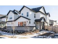 Stunning two-story home with white siding and gray accents at 10270 E 62Nd Pl, Denver, CO 80238