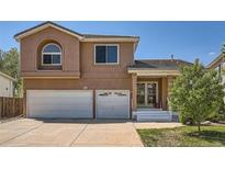 Charming two-story home with a two-car garage and inviting front porch at 20336 E 48Th Dr, Denver, CO 80249