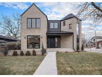 Modern two-story home with brick exterior and landscaped lawn at 760 Jersey St, Denver, CO 80220