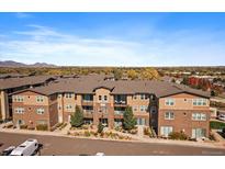 Attractive brick apartment building with mountain views and ample parking at 15274 W 64Th Ln # 206, Arvada, CO 80007