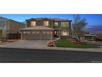 Charming two-story home featuring a spacious three-car garage and professionally landscaped front yard at 9109 Ironwood Way, Highlands Ranch, CO 80129