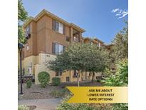 Attractive condo building with well-maintained landscaping and a private outdoor space at 803 E 98Th Ave # 105, Thornton, CO 80229