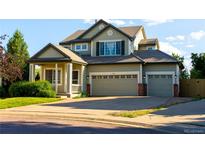 Charming two-story home with a well-maintained front yard and three car garage at 3232 Cimarron Pl, Superior, CO 80027