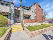 Attractive condo with brick accents, multiple balconies and nicely landscaped grounds at 11985 E Harvard Ave # 108, Aurora, CO 80014