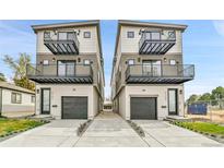Modern townhomes boast multi-level balconies and attached garages at 2164 S Ash St, Denver, CO 80222