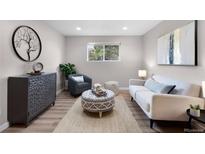 Cozy living room features modern decor, wood floors, and bright natural light at 16359 W 10Th Ave # T1, Golden, CO 80401