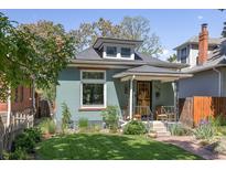 Charming home featuring a tidy front lawn, covered porch, and inviting curb appeal at 2445 N Franklin St, Denver, CO 80205