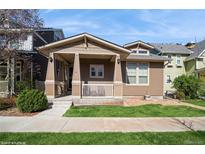 Charming single-Gathering home featuring a cozy front porch and manicured lawn in a friendly neighborhood at 9675 E 105Th Ave, Commerce City, CO 80640