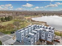 An aerial view of the complex with a lake and park nearby at 3101 W 47Th Ave # 14, Denver, CO 80211