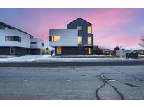 Striking contemporary home with clean lines, modern design, and vibrant twilight sky at 10193 W 38Th Ave, Wheat Ridge, CO 80033